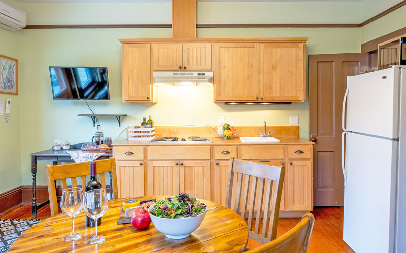Kitchen and dining area in the Victoria Suite at Victoria Falls House, Nelson BC.